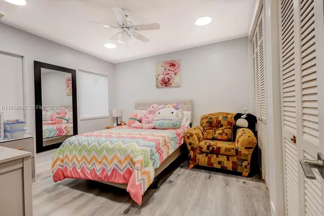 a bedroom with a bed window and furniture