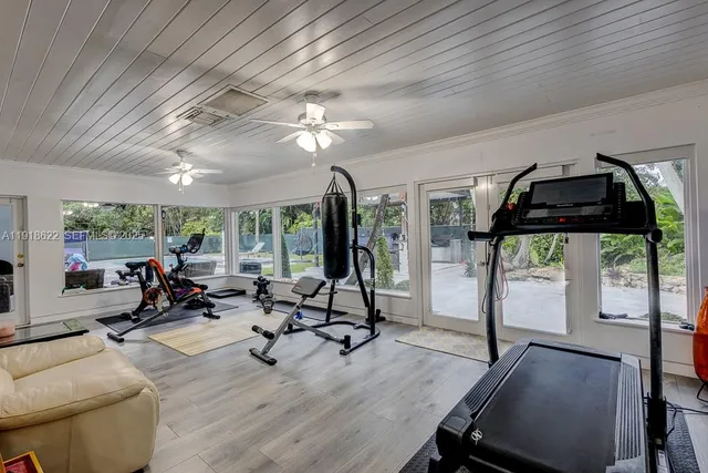 a kitchen with a sink a table and chairs