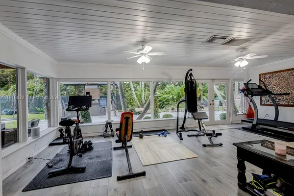a view of a patio with a table and chairs