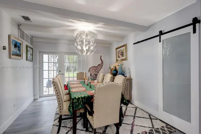 a view of a patio with a table and chairs