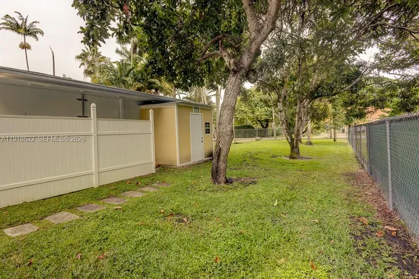 a view of a yard with swimming pool
