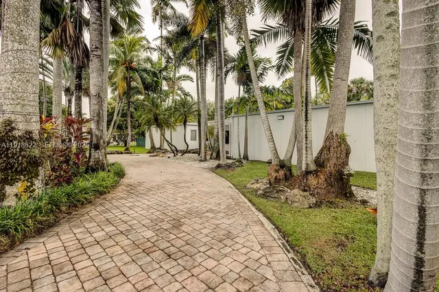 a bathroom with a sink toilet and mirror