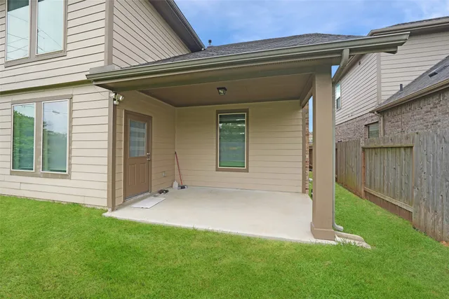 a backyard of a house with lots of green space