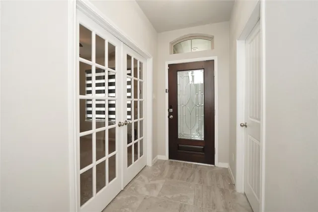 a kitchen with kitchen island granite countertop a sink stainless steel appliances and cabinets