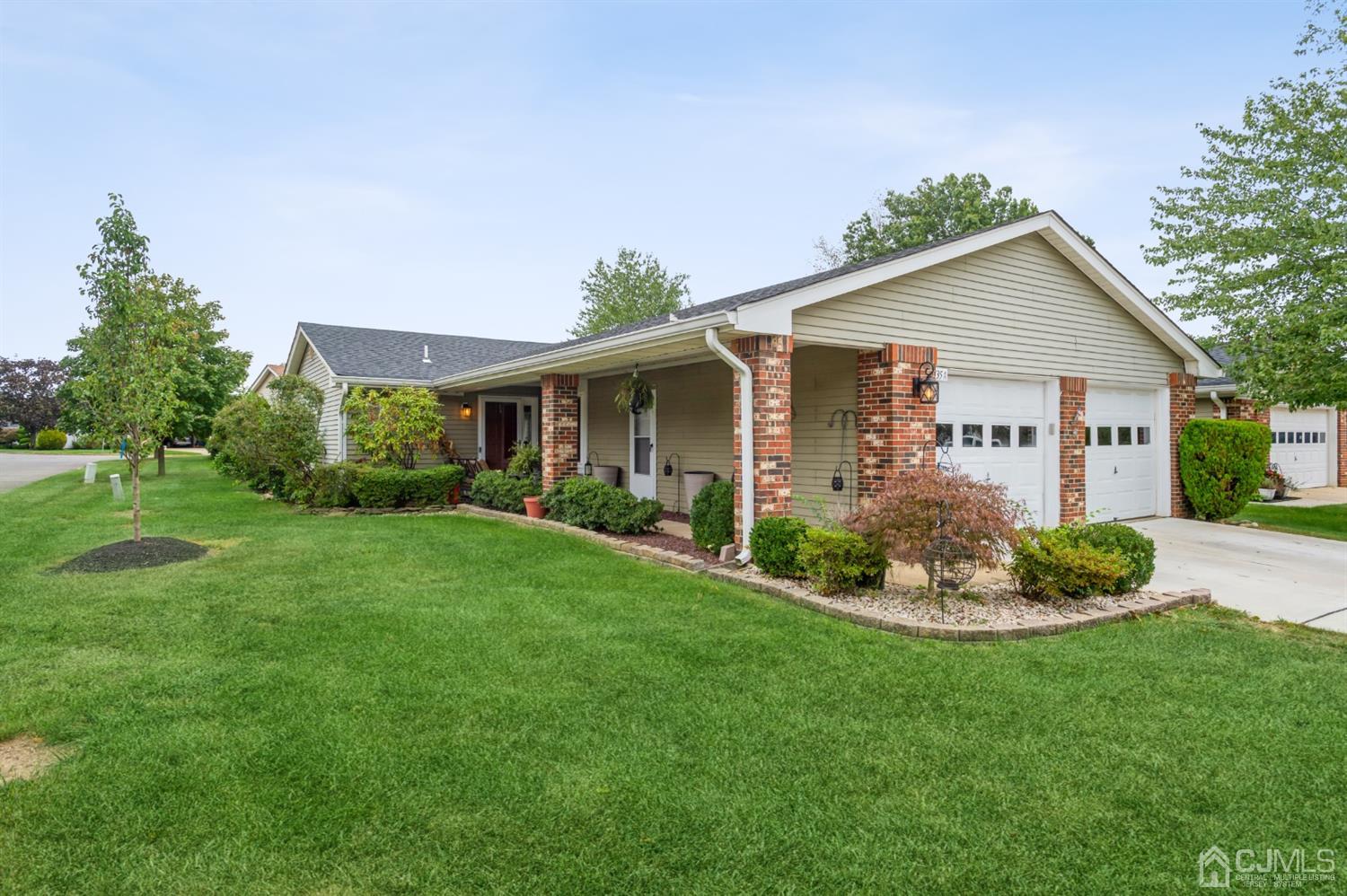 735 Prospect Road, Unit A Monroe Township, NJ 08831 - Photo 1 of 20 a view of a house with a yard and potted plants