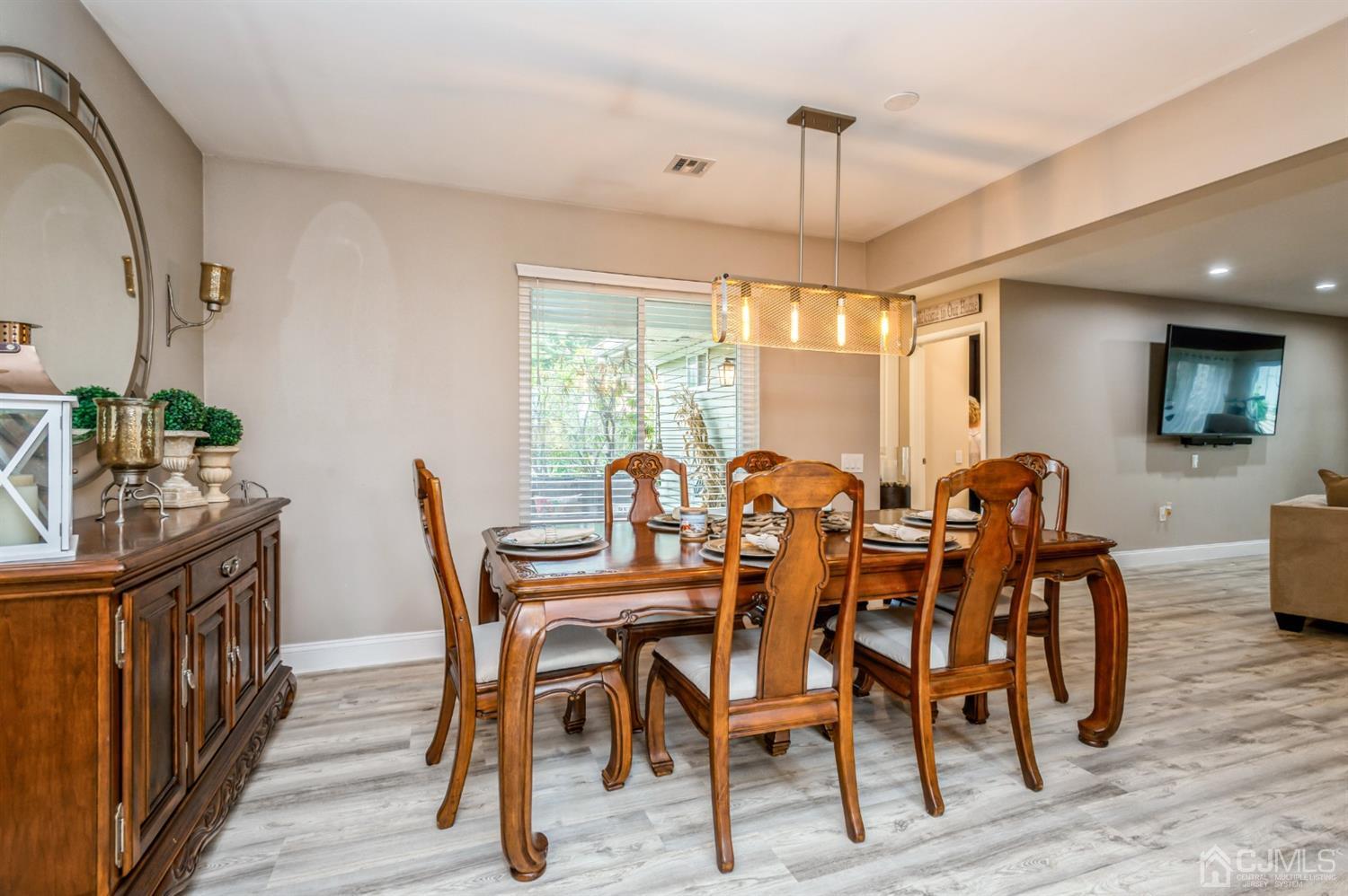 735 Prospect Road, Unit A Monroe Township, NJ 08831 - Photo 12 of 20 a view of a a dining room with furniture window and wooden floor