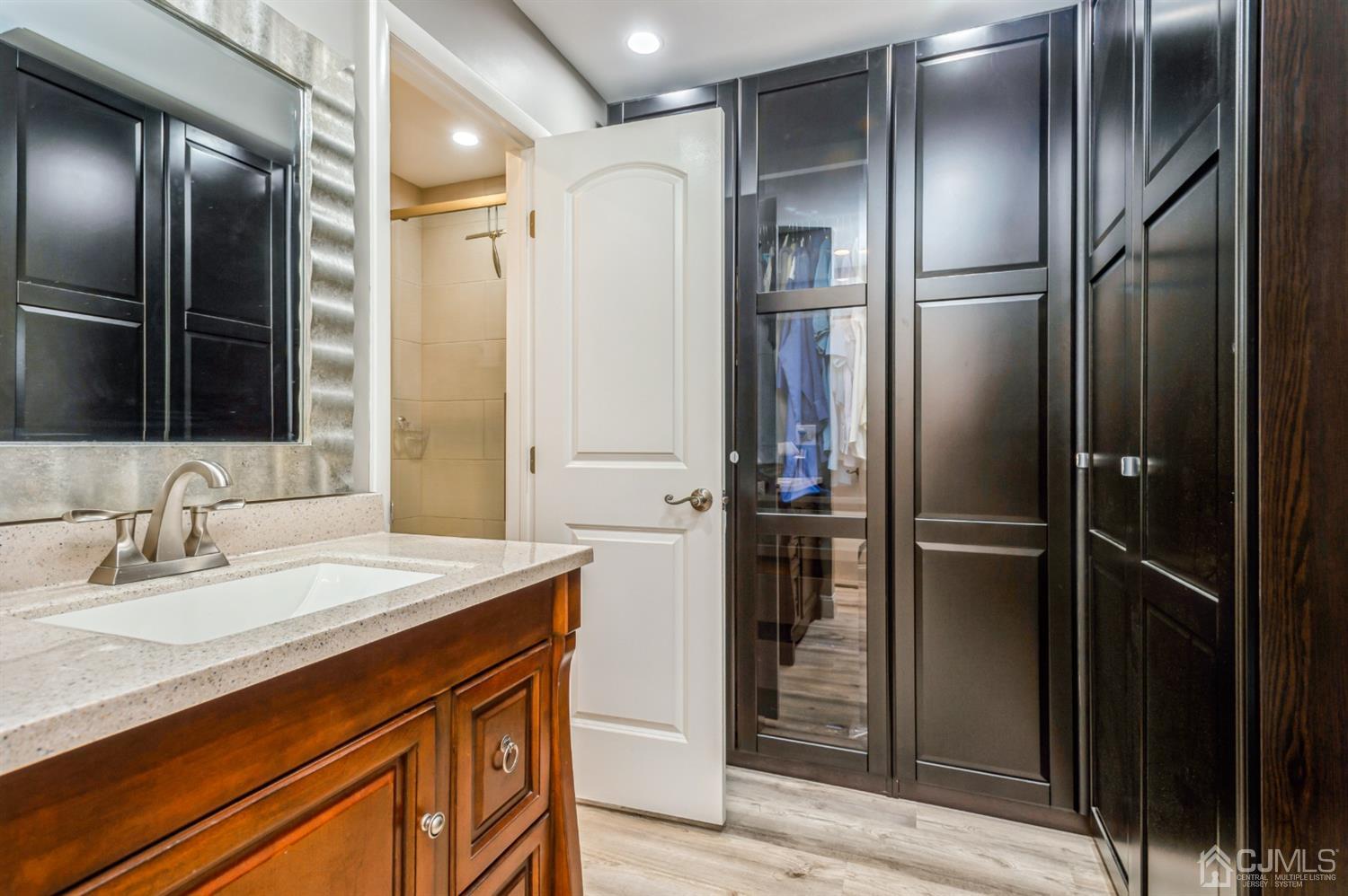 735 Prospect Road, Unit A Monroe Township, NJ 08831 - Photo 20 of 20 a bathroom with a sink and a mirror