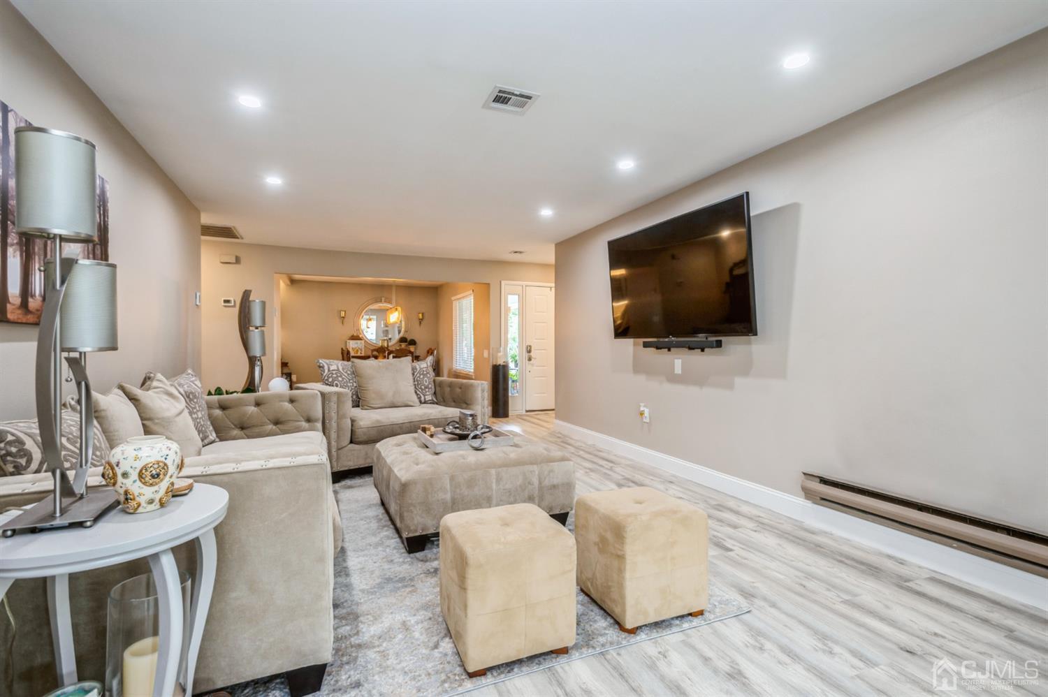 735 Prospect Road, Unit A Monroe Township, NJ 08831 - Photo 3 of 20 a living room with furniture and a flat screen tv