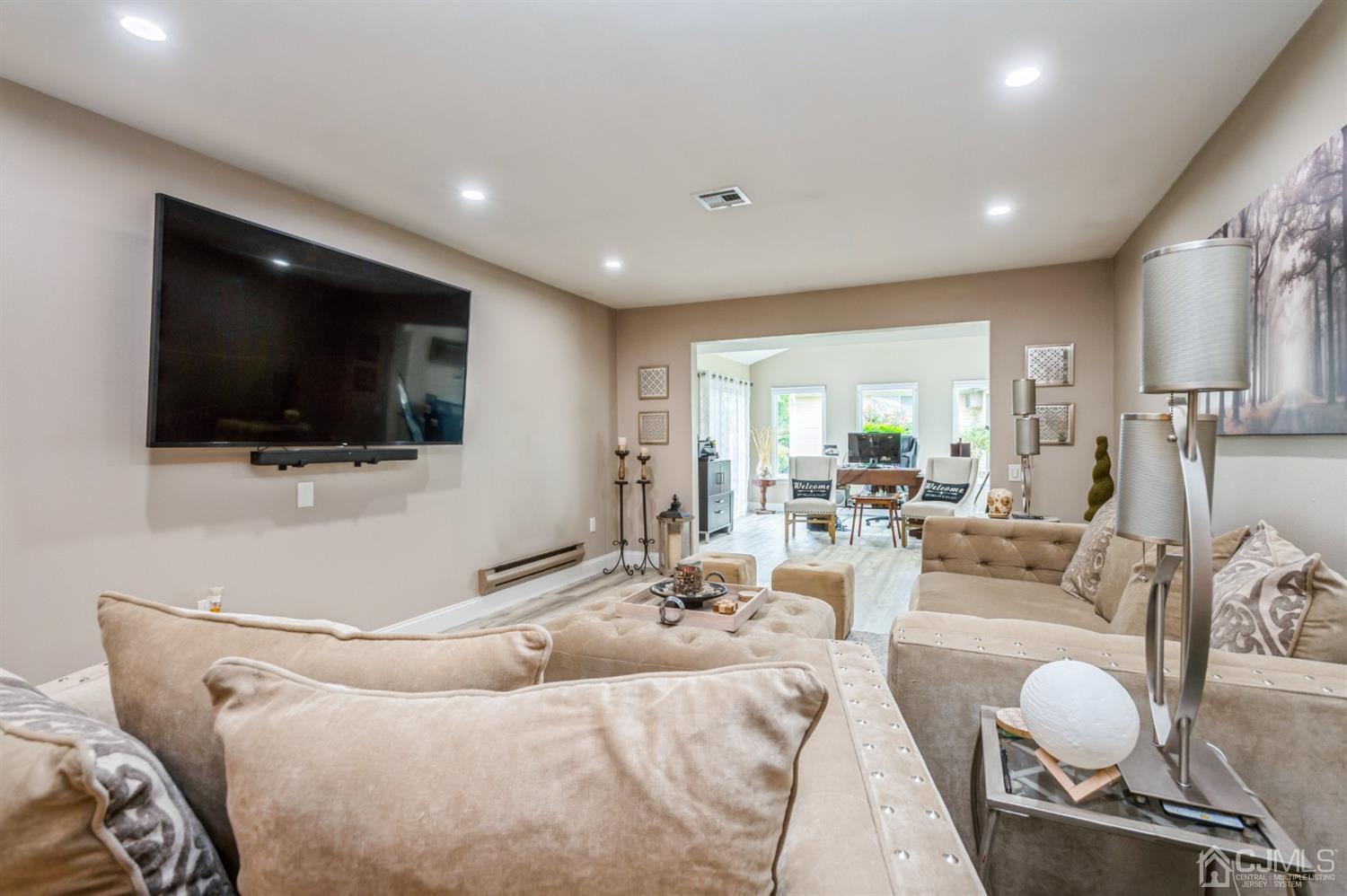 735 Prospect Road, Unit A Monroe Township, NJ 08831 - Photo 6 of 20 a living room with furniture and a flat screen tv