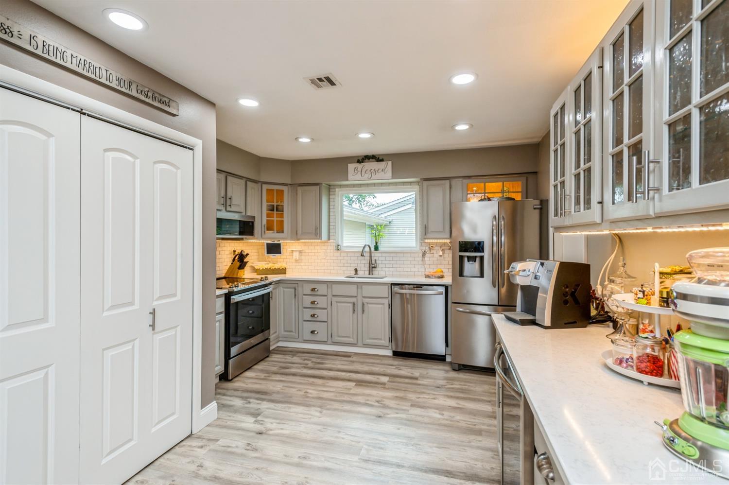 735 Prospect Road, Unit A Monroe Township, NJ 08831 - Photo 7 of 20 a kitchen with stainless steel appliances granite countertop lots of counter top space and cabinets