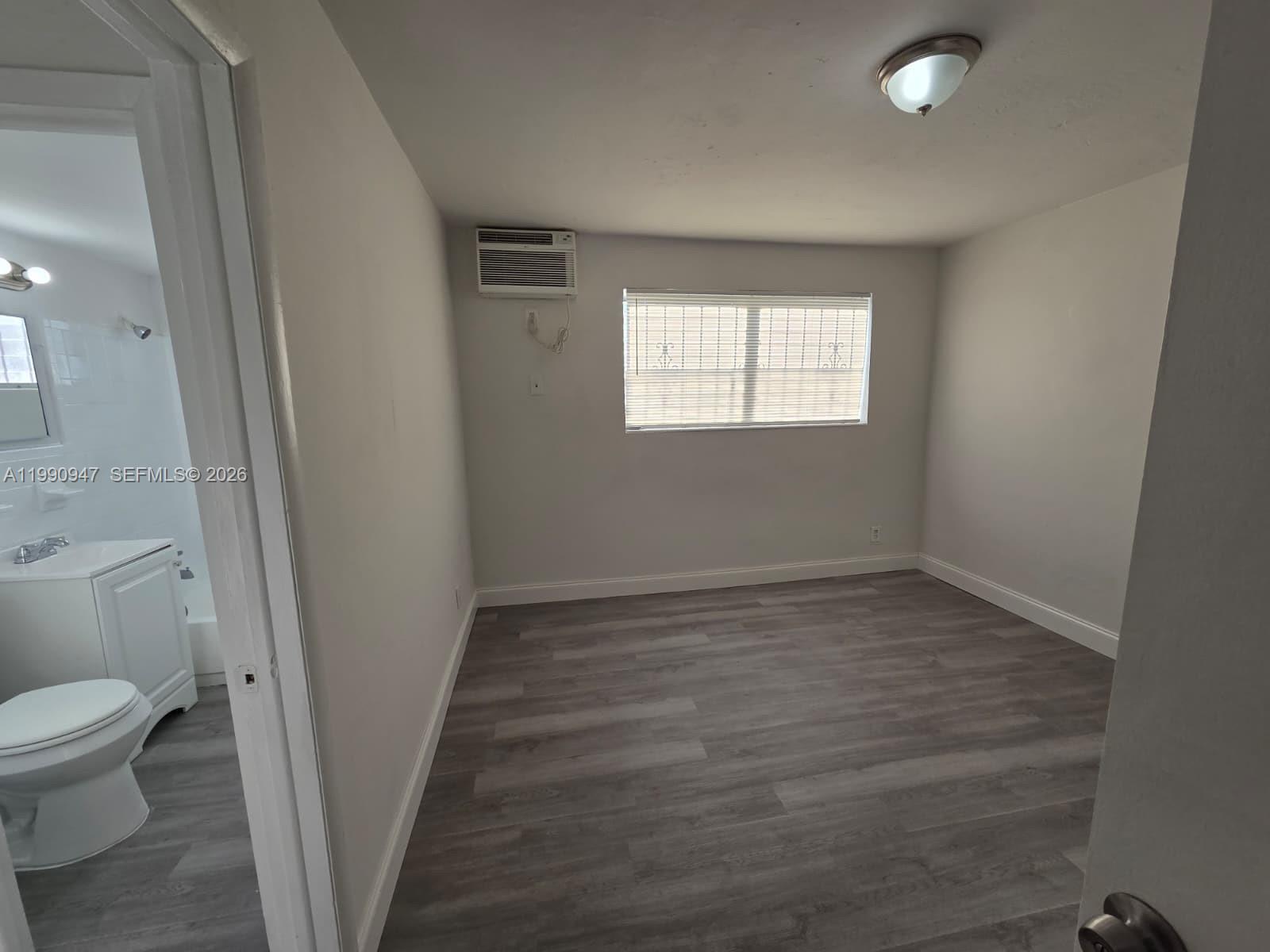 1628 Southwest 7th Street, Unit 4 Miami, FL 33135 - Photo 3 of 6 a view of a bathroom with a sink and a toilet