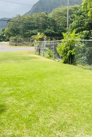 a view of a garden with an ocean view