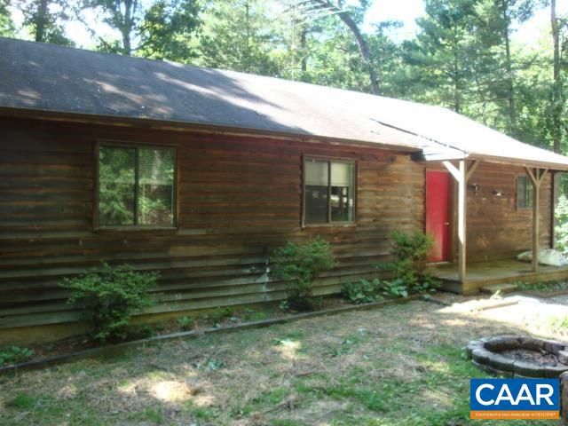 2614 Rio Mills Road Earlysville, VA 22936 - Photo 1 of 8 a view of brick house with a yard
