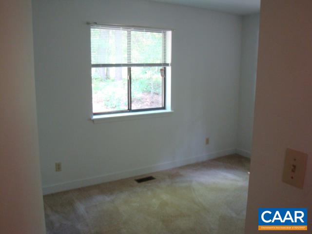 2614 Rio Mills Road Earlysville, VA 22936 - Photo 5 of 8 an empty room with a window