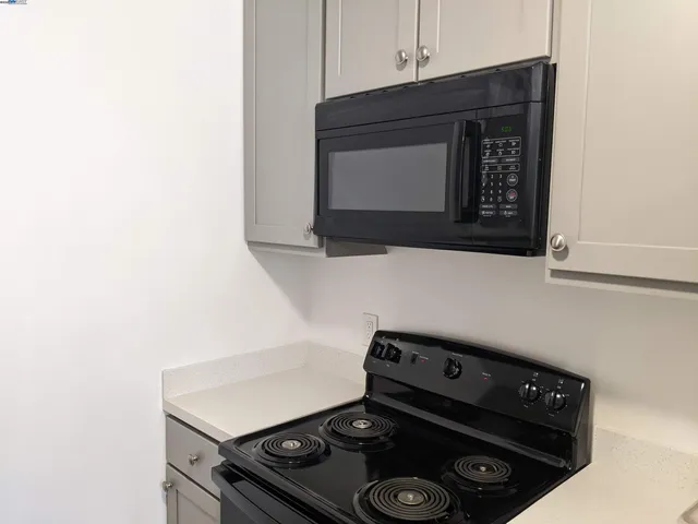 a close up of a stove sitting inside of a kitchen