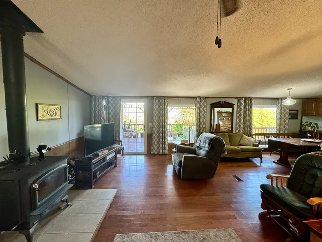 a kitchen with a sink refrigerator and cabinets