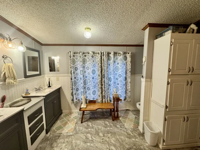 a view of house with a yard