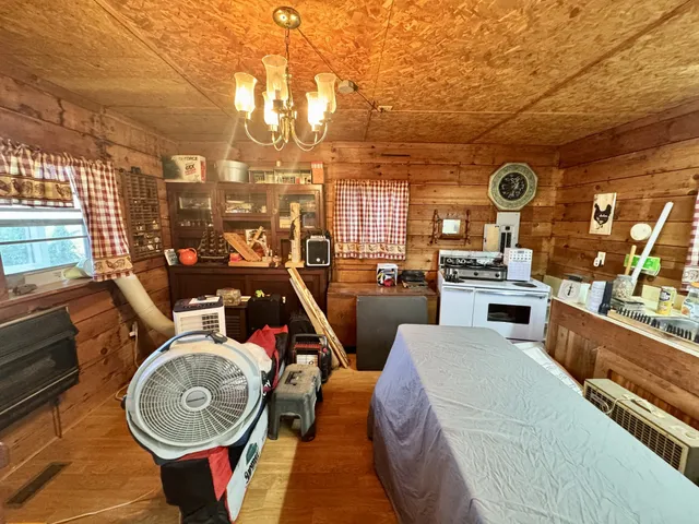 a view of a house with a yard and sitting area
