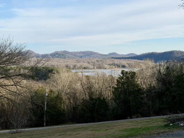 a view of a lake with mountains in the background