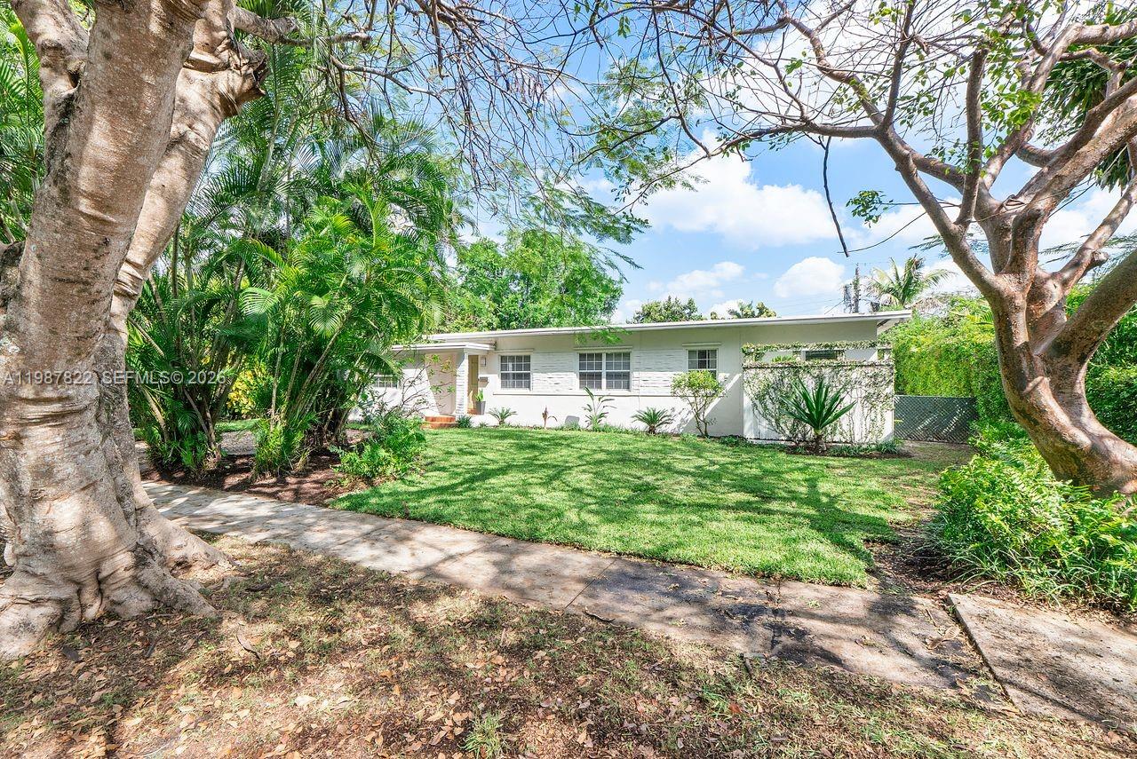 5961 Southwest 46th Terrace Miami, FL 33155 - Photo 1 of 28 a view of a house with a yard