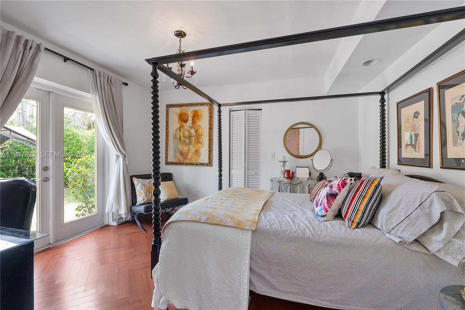 5961 Southwest 46th Terrace Miami, FL 33155 - Photo 16 of 28 a bed room with a bed and a large window
