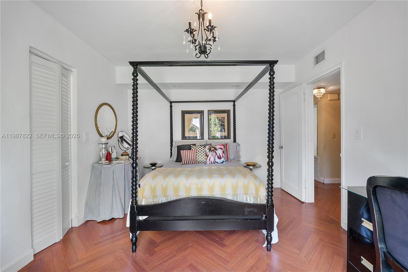 5961 Southwest 46th Terrace Miami, FL 33155 - Photo 17 of 28 a bed sitting in a bedroom next to a window