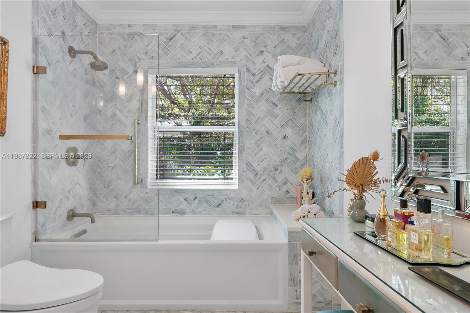 5961 Southwest 46th Terrace Miami, FL 33155 - Photo 19 of 28 a bathroom with a sink a toilet and a bathtub