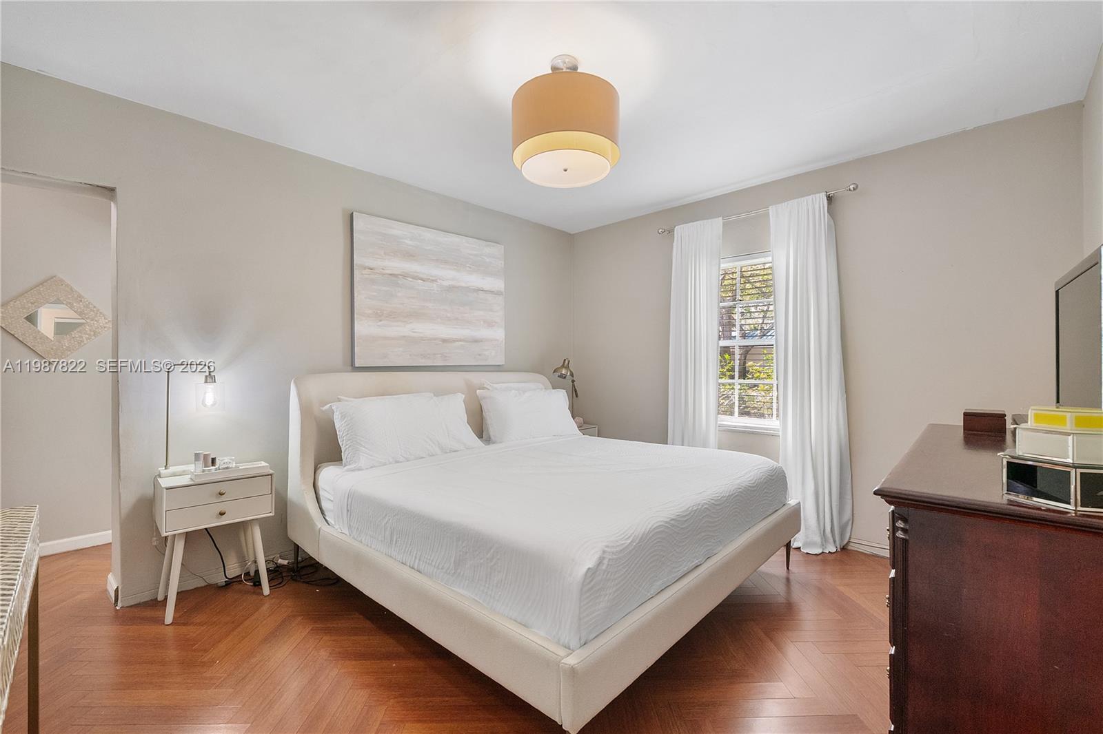 5961 Southwest 46th Terrace Miami, FL 33155 - Photo 20 of 28 a bedroom with a bed and a window