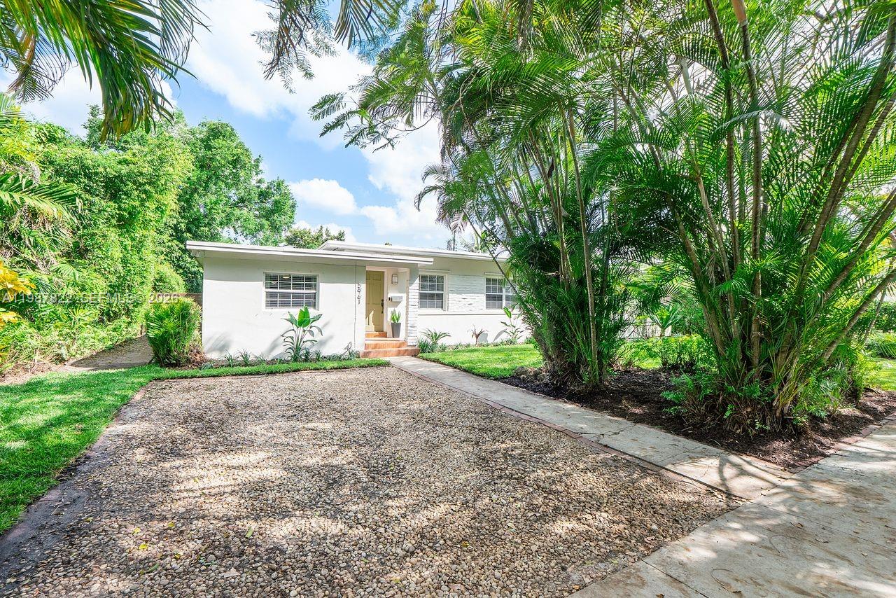 5961 Southwest 46th Terrace Miami, FL 33155 - Photo 3 of 28 a view of a house with a tree in front of it