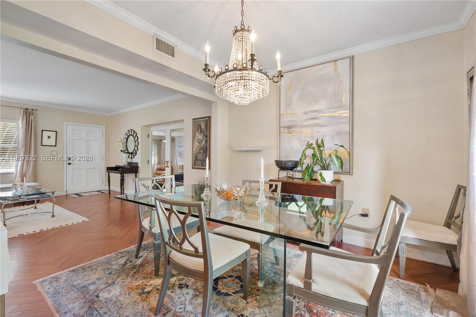5961 Southwest 46th Terrace Miami, FL 33155 - Photo 8 of 28 a view of a dining room with furniture wooden floor and chandelier