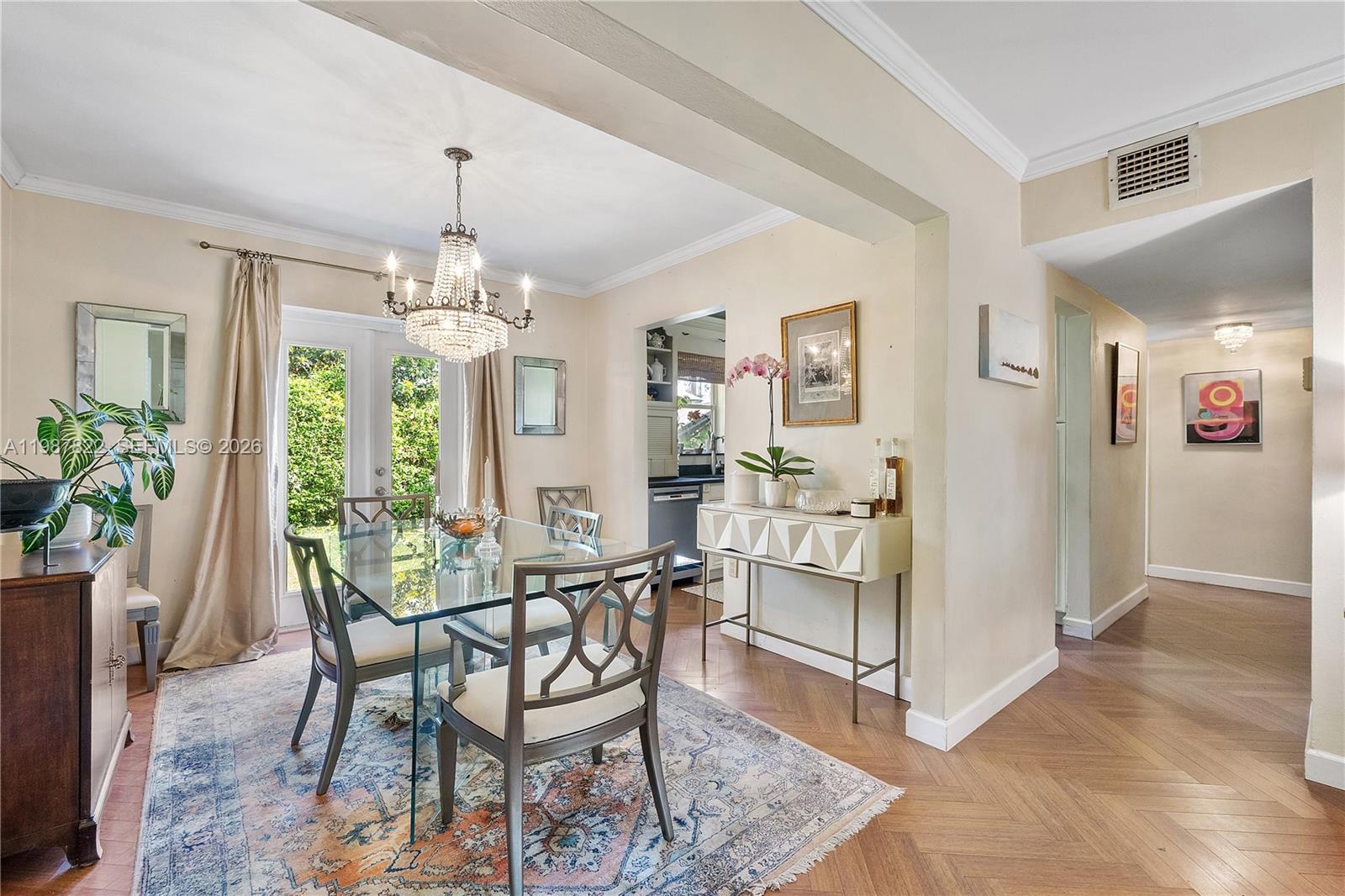 5961 Southwest 46th Terrace Miami, FL 33155 - Photo 9 of 28 a view of a dining room with furniture and chandelier