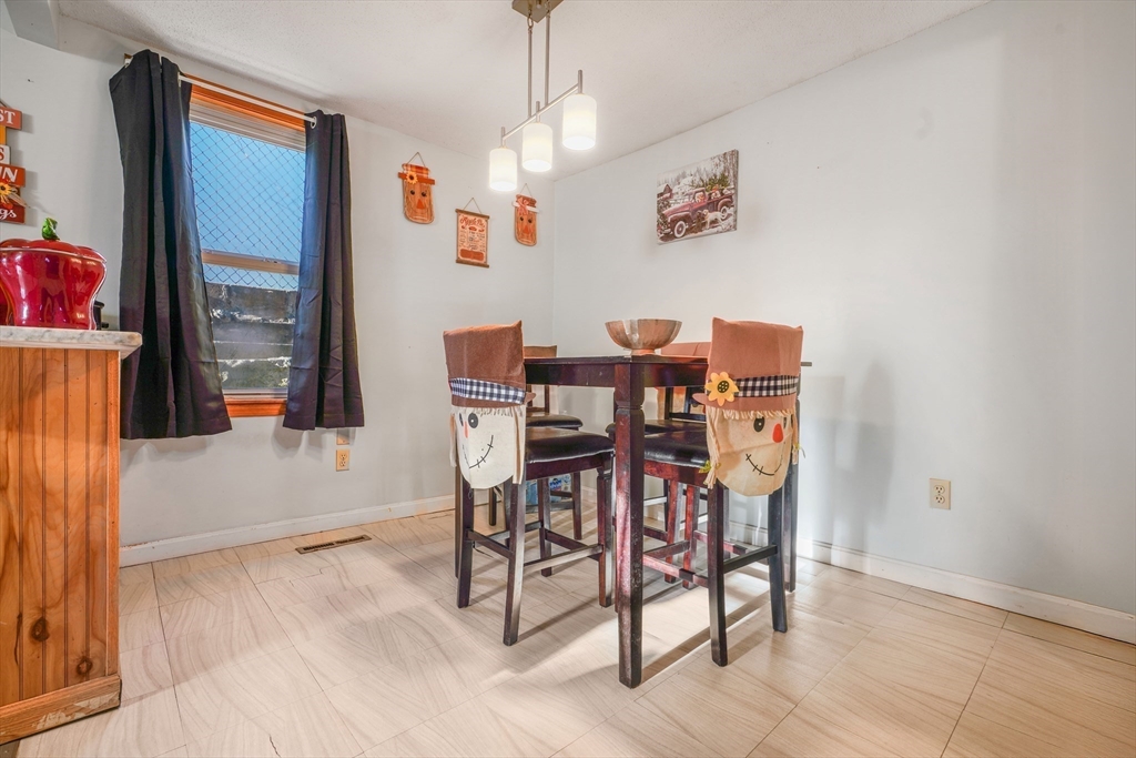 45 Boutwell Street Fall River, MA 02723 - Photo 12 of 36 a view of a dining room with furniture and window