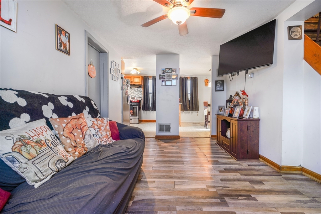 45 Boutwell Street Fall River, MA 02723 - Photo 14 of 36 a living room with furniture and a flat screen tv