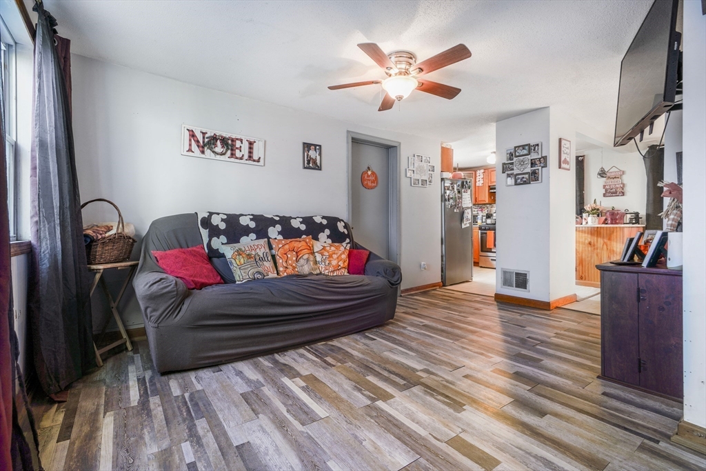 45 Boutwell Street Fall River, MA 02723 - Photo 15 of 36 a living room with furniture and a flat screen tv
