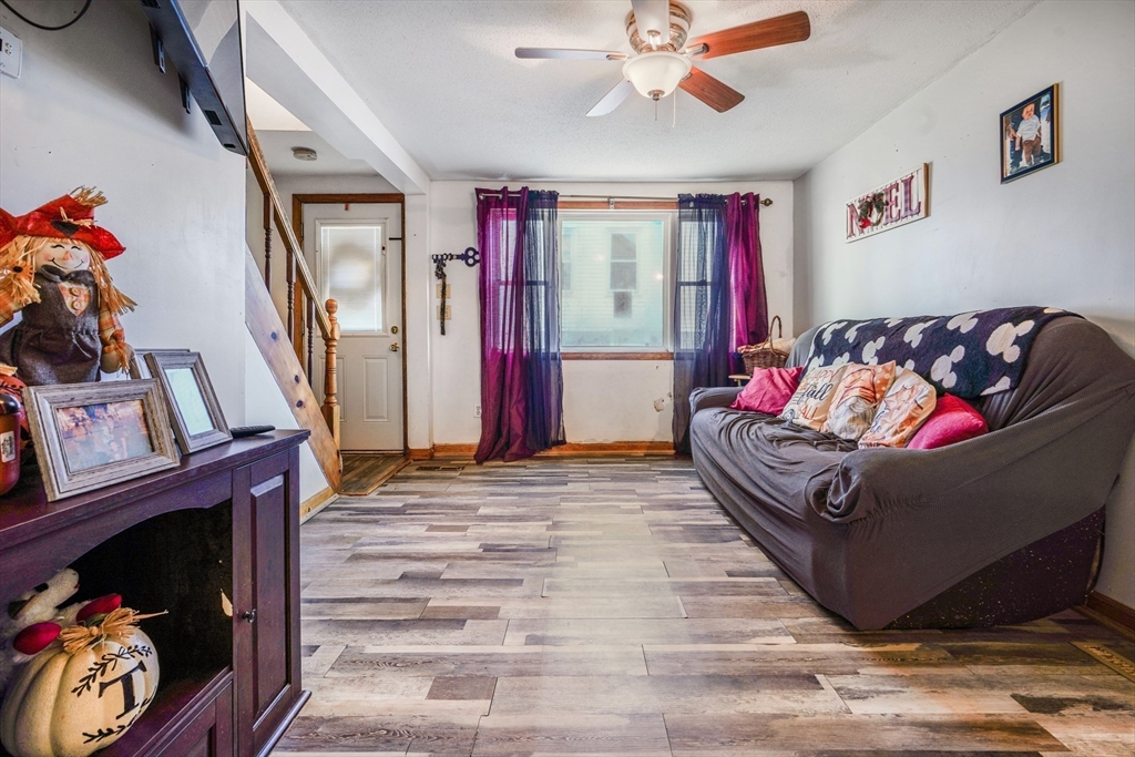 45 Boutwell Street Fall River, MA 02723 - Photo 17 of 36 a living room with furniture and a fireplace