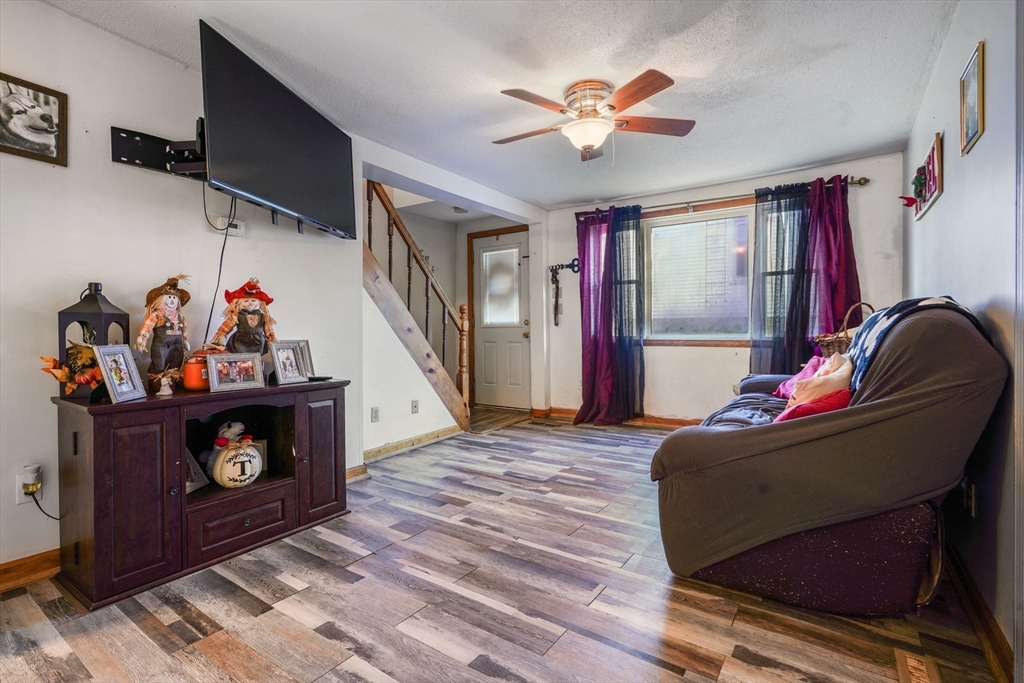 45 Boutwell Street Fall River, MA 02723 - Photo 18 of 36 a living room with furniture and a fireplace