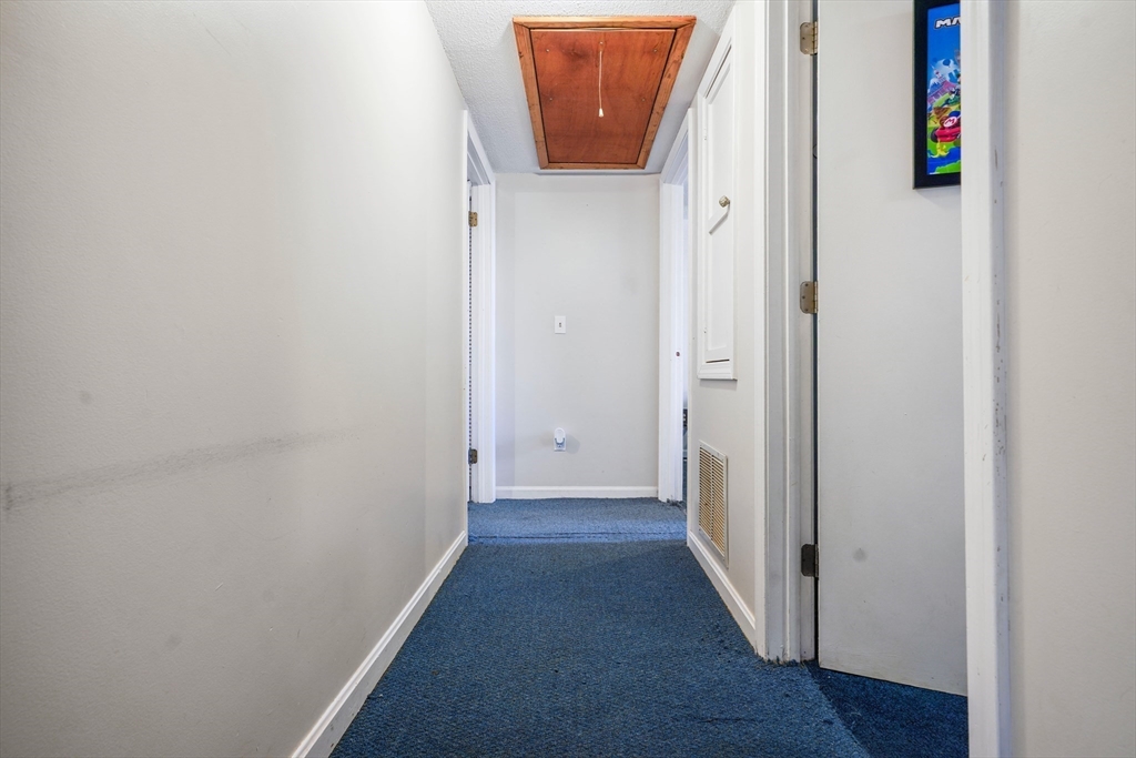 45 Boutwell Street Fall River, MA 02723 - Photo 19 of 36 a view of a hallway with wooden floor