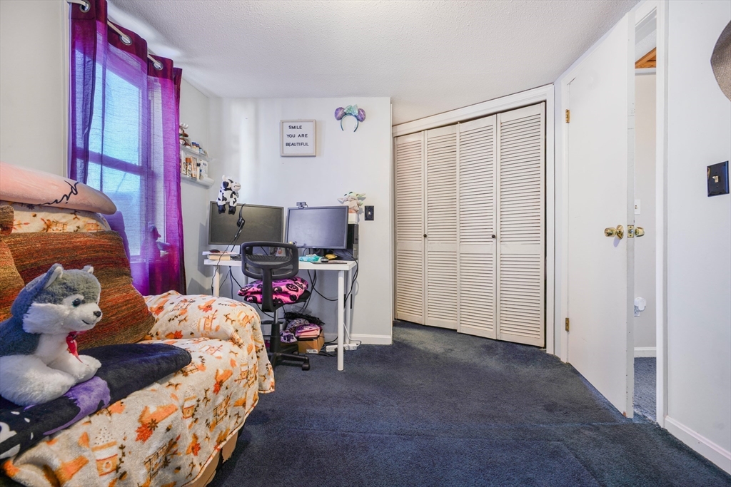 45 Boutwell Street Fall River, MA 02723 - Photo 20 of 36 a bedroom with a bed and a closet