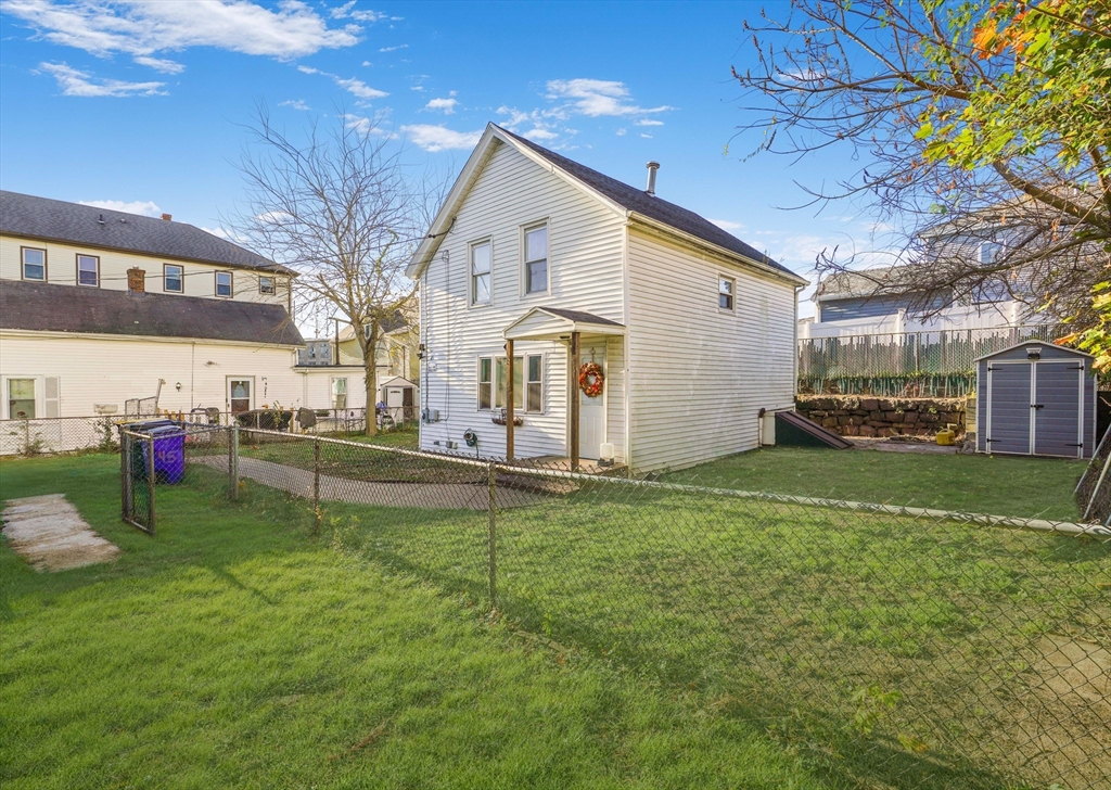 45 Boutwell Street Fall River, MA 02723 - Photo 2 of 36 a view of a house with a backyard