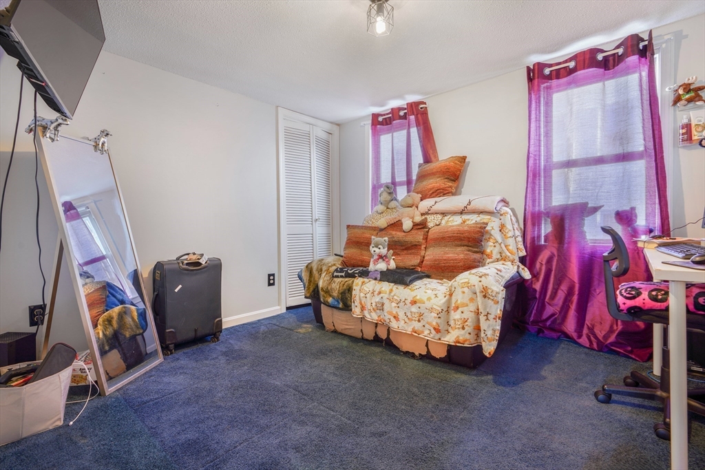 45 Boutwell Street Fall River, MA 02723 - Photo 23 of 36 a bedroom with furniture and a window