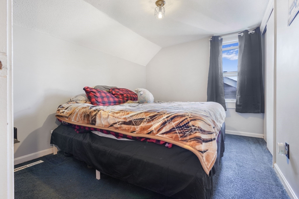 45 Boutwell Street Fall River, MA 02723 - Photo 25 of 36 a bedroom with a bed and a window