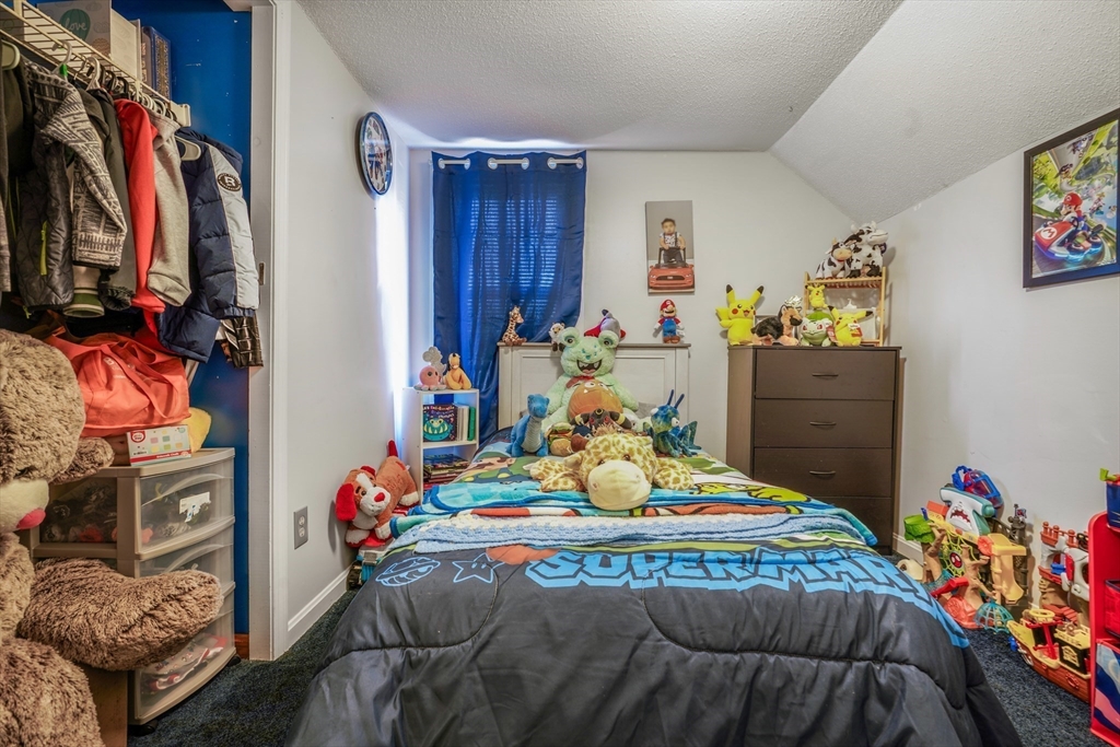 45 Boutwell Street Fall River, MA 02723 - Photo 27 of 36 a bedroom with furniture and a bed