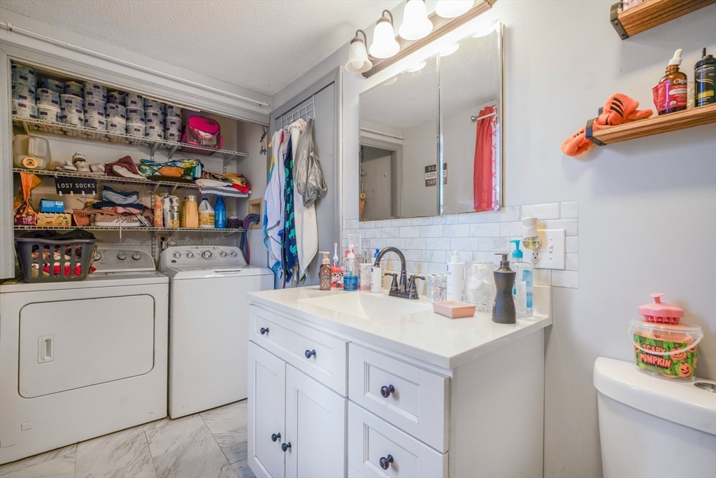 45 Boutwell Street Fall River, MA 02723 - Photo 28 of 36 a utility room with sink dryer and washer