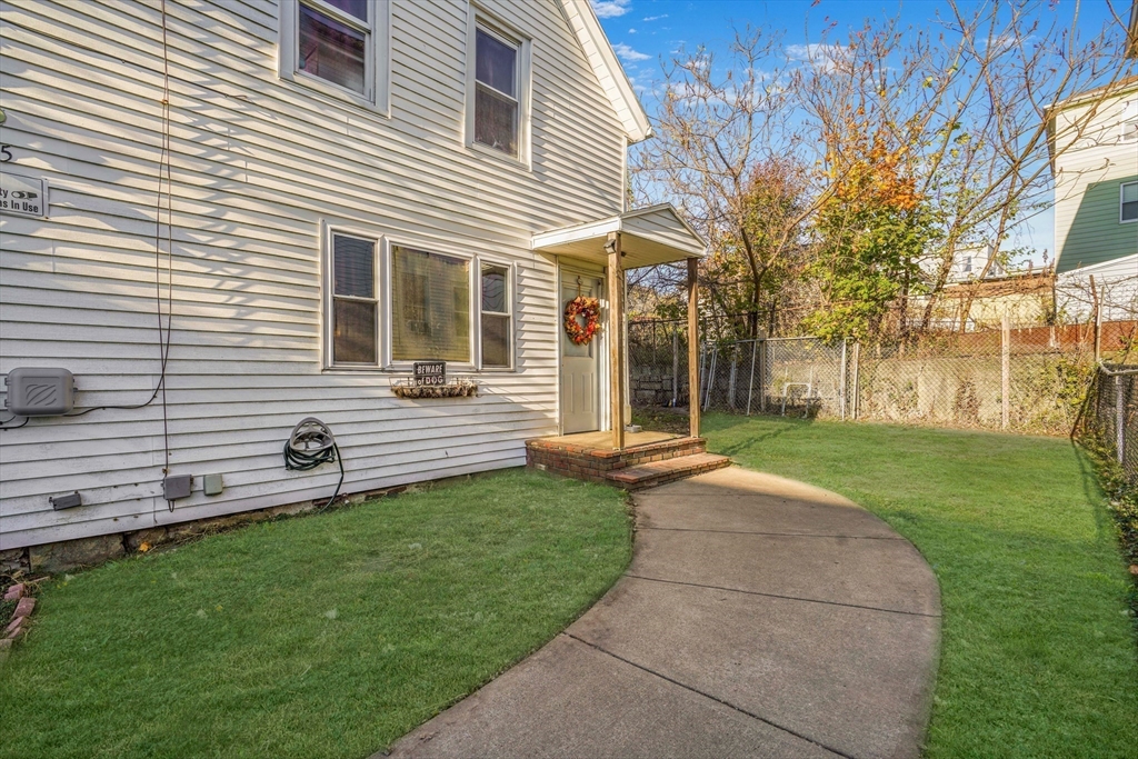 45 Boutwell Street Fall River, MA 02723 - Photo 32 of 36 a view of a house with a backyard