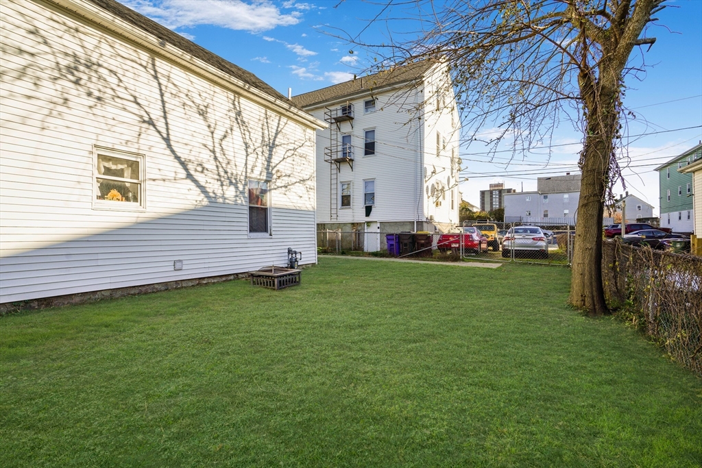 45 Boutwell Street Fall River, MA 02723 - Photo 34 of 36 a view of a house with a back yard