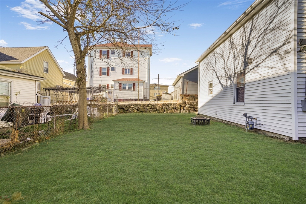 45 Boutwell Street Fall River, MA 02723 - Photo 5 of 36 a view of a house with a yard