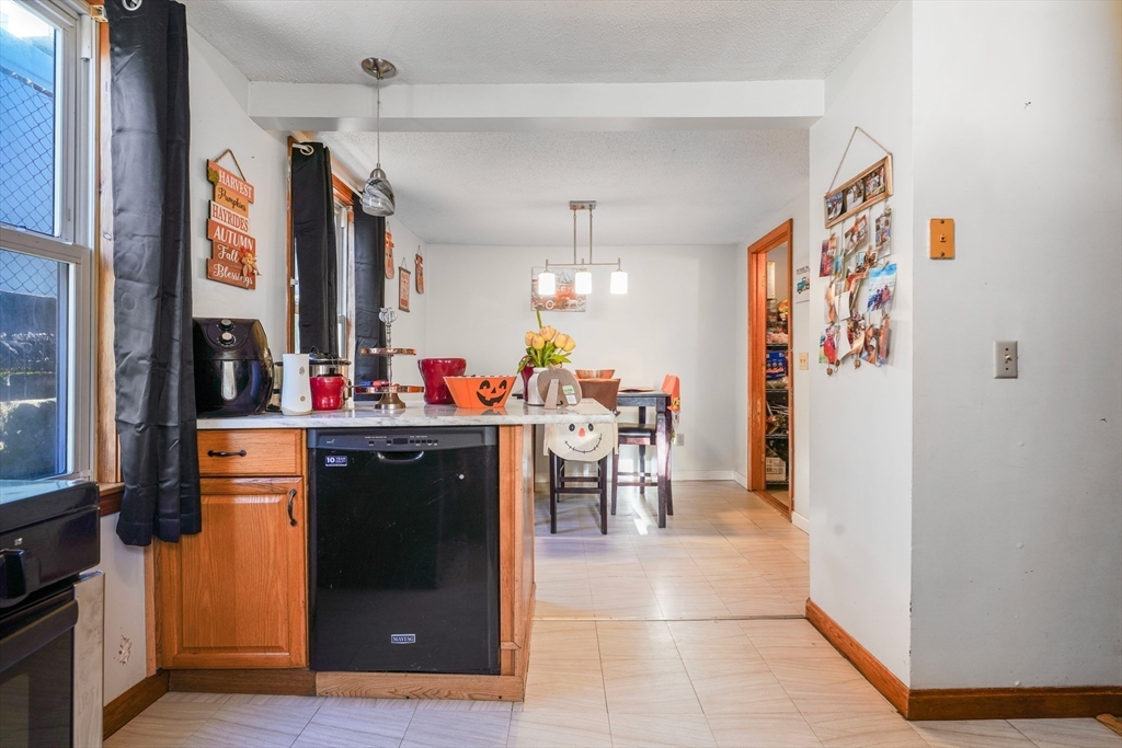 45 Boutwell Street Fall River, MA 02723 - Photo 8 of 36 a view of a kitchen with furniture and a window