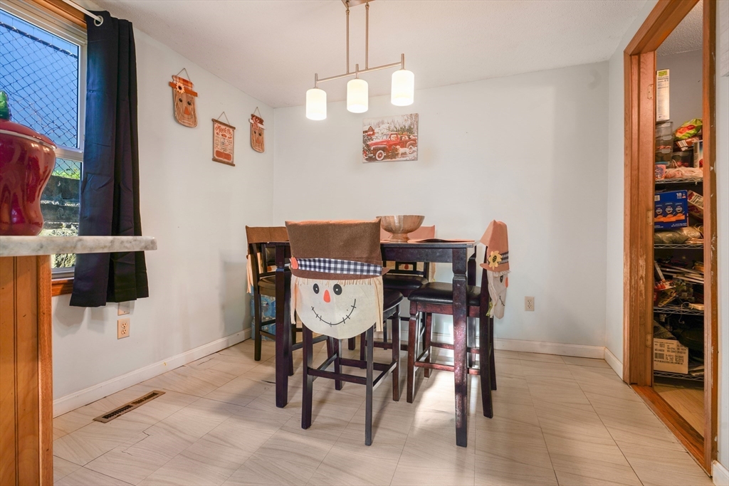 45 Boutwell Street Fall River, MA 02723 - Photo 10 of 36 a view of a dining room with furniture and wooden floor