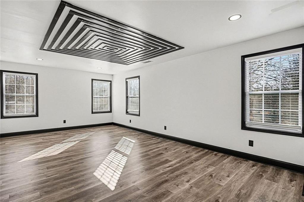 166 Evans Road Griffin, GA 30223 - Photo 15 of 36 a view of a room with wooden floor and windows