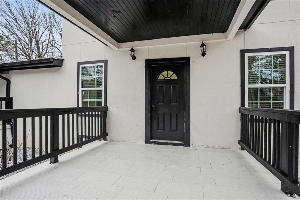 166 Evans Road Griffin, GA 30223 - Photo 30 of 36 a view of a porch with wooden floor and door